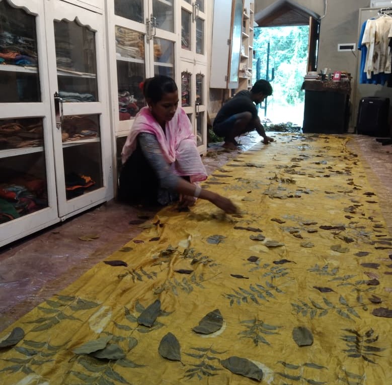 Woman working on handmade saree